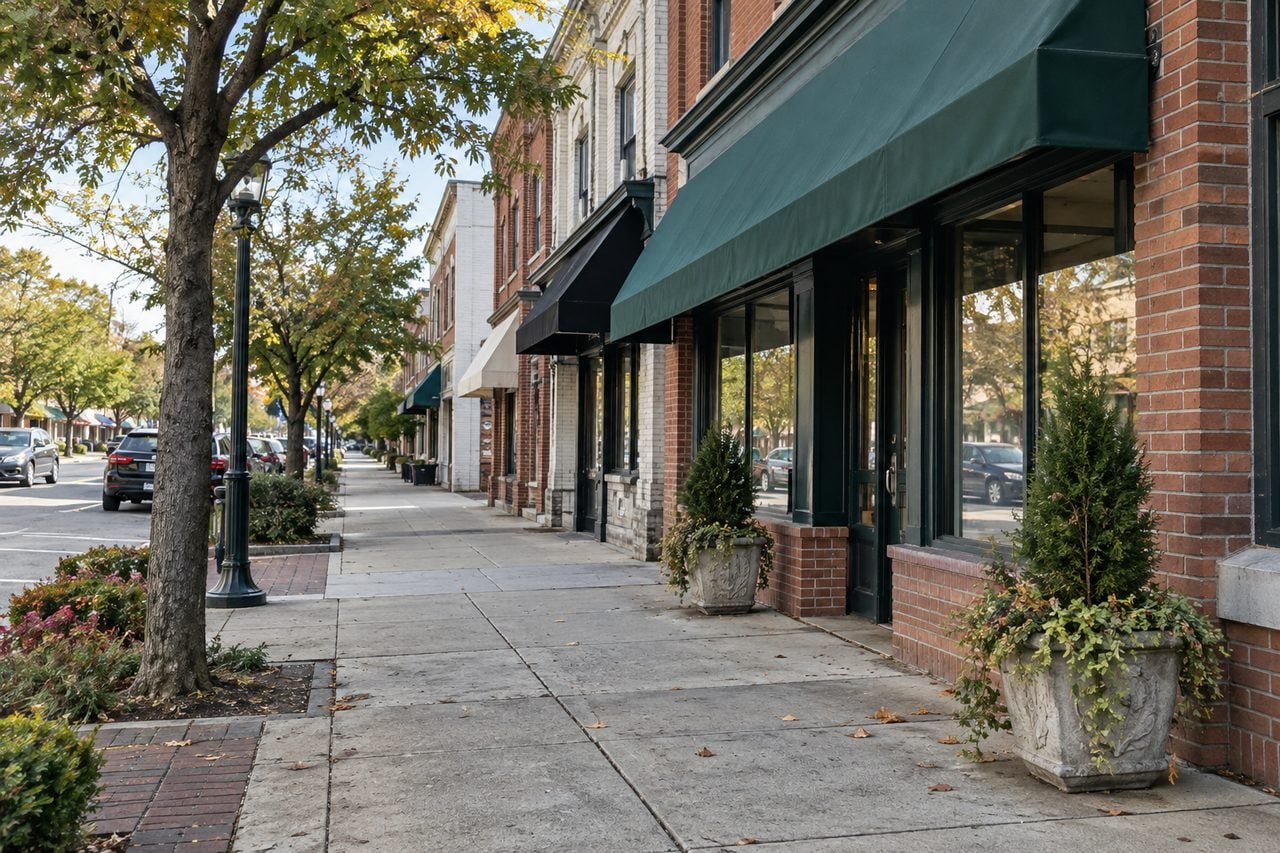 A tree-lined small-town street inspired by Bergen County