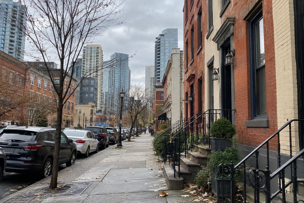 A Jersey City-inspired streetscape with brick buildings and apartments
